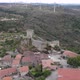 Aerial pullback reveals Castle of Sortelha and its fortifications; Portugal - VideoHive Item for Sale
