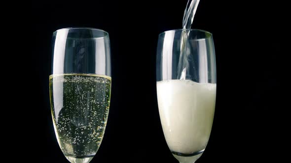 Champagne Poured Into Two Glasses alt