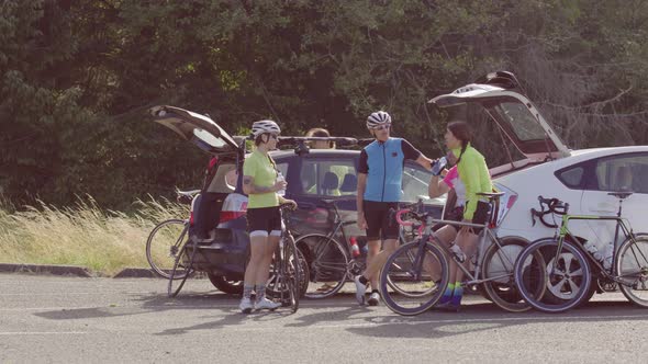 Group of cyclists taking break and preparing for ride.  Fully released for commercial use.