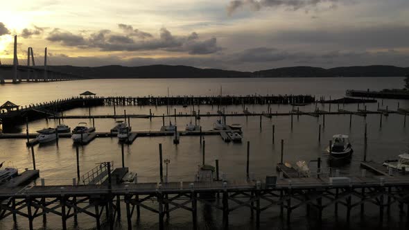 A low angle shot of the Tarrytown Marina in upstate NY. The Mario M. Cuomo Bridge in in the backgrou alt
