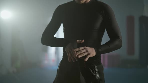 Fighter Wraps Her Hands with Boxing Bandages Kickboxing Training Day in a Gym the Man Fighter is alt