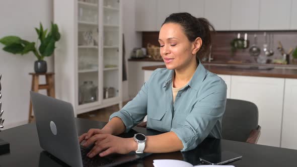 Smiling Business Woman Using Laptop for Remote Work From Home