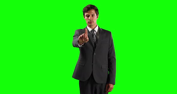 Front view of a Caucasian man touching the screen with green screen alt