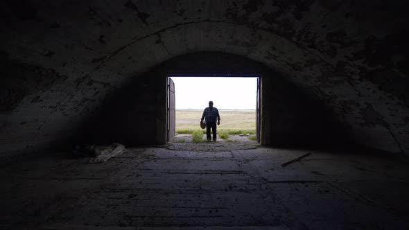 Desperate farmer near an empty barn.  World economic crisis alt
