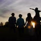 Three Generation Family Walk in Meadow at Sunset - VideoHive Item for Sale