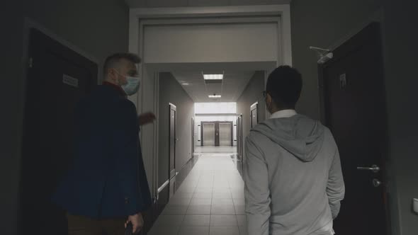 Covid-19 or Corona Virus Situation in Business Concept. Businessman and His Assistant alt