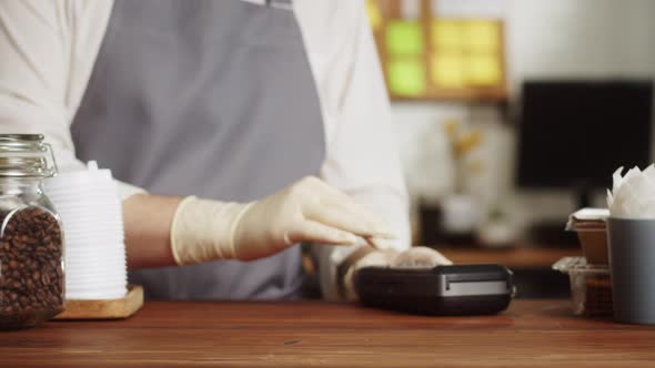 Paying with Smartphone Closeup Using NFC Technology in a Restaurant alt