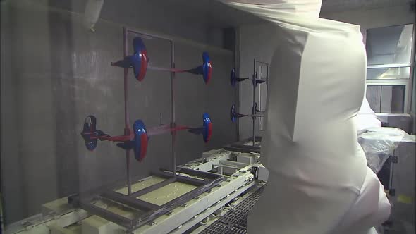 car painting with robots in car factory alt