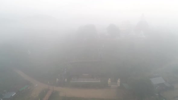 Aerial Footage Of Wat Su Tong Pae, Famous Temple In Mae Hong Son, Thailand in Foggy Weather alt