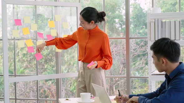 Business People Work on Project Planning Board alt