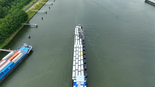 Vehicles Transported by Boat Entering the Volkerak Lock in the Netherlands alt