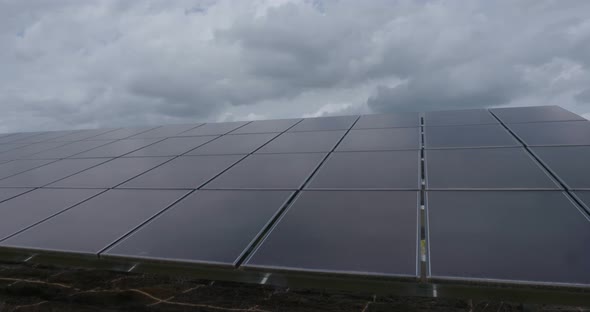 shots of solar panels on a solar farm alt