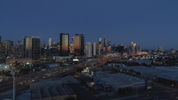 Approaching Melbourne City at dusk highway traffic in foreground alt