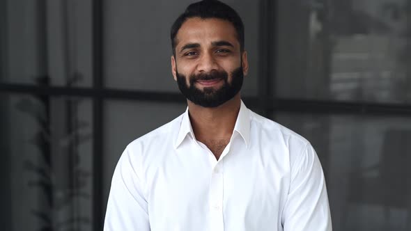 Closeup Video Portrait of a Successful Intelligent Bearded Indian Businessman Manager or IT alt