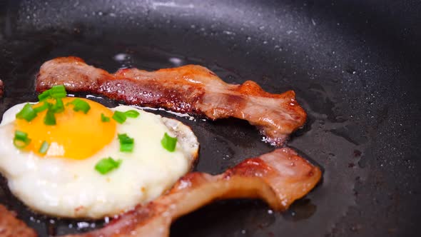 Fried Bacon with Eggs in a Pan