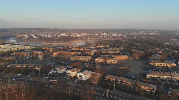 Aerial View Over the Small Town While Rooftops in Autumn Time alt