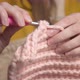 Closeup of Young Female Hands of a Caucasian Girl Doing Crochet Shows How to Knit Correctly - VideoHive Item for Sale