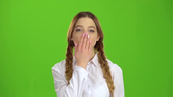 Student Sends an Air Kiss. Green Screen alt