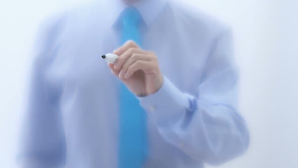 Idea Written on Glass. Businessman Hand Writing Words with Marker Pen