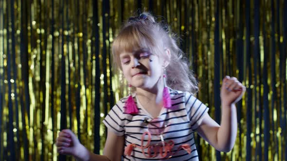 Teen Kid Girl Listening To Music Dancing Energetic Rhythm Shaking Head in Slow Motion at Disco Club alt