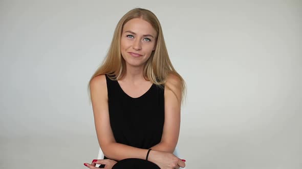 Portrait of Adorable Young Blonde European Woman Smiling Talking Looking at Camera Medium Shot