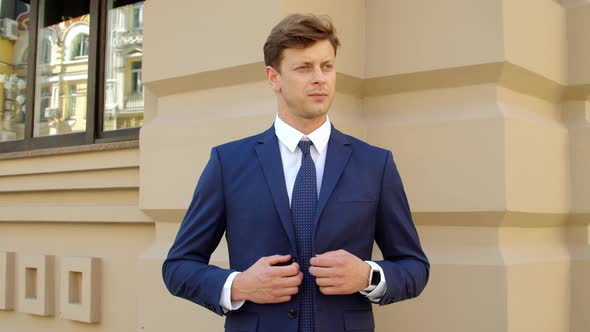 Portrait of Young Man Waiting Meeting Outdoors. Confident Business Man alt