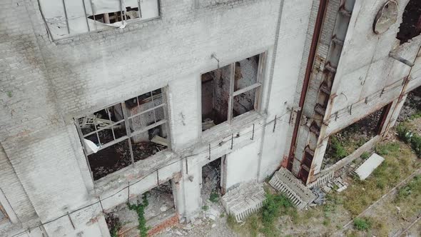 Aerial view of a destroyed factory during the war. Abandoned industrial building. alt