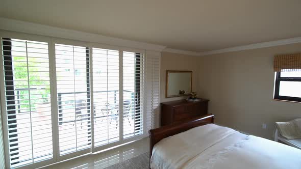 Walking Into Bedroom With Venetian Blinds alt