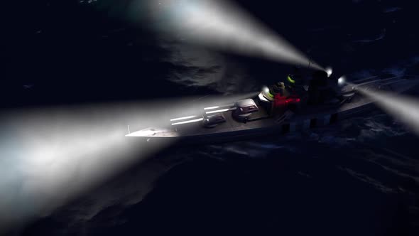Battleship In The Open Ocean By Night With The Searchlights On alt