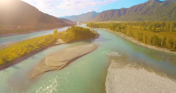 Low Altitude Flight Over Fresh Fast Mountain River with Rocks at Sunny Summer Morning alt
