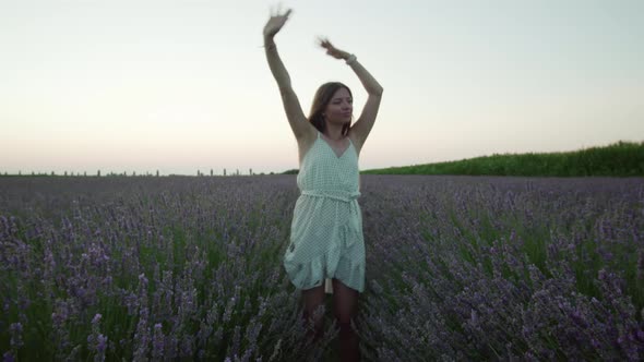 Woman Dances on the Lavender Field in the Evening alt