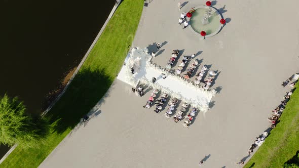 Aerial Drone View Wedding at Lake Promenade with Guests alt