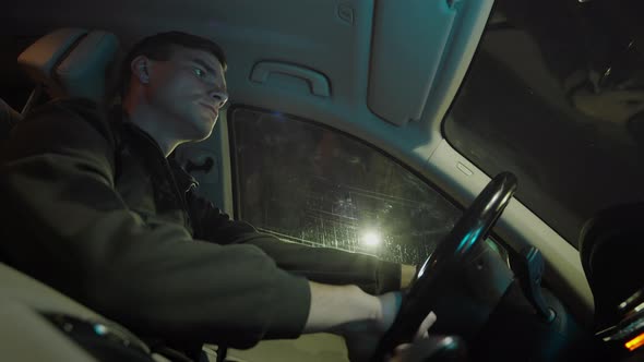 Man Is Driving Car At Night