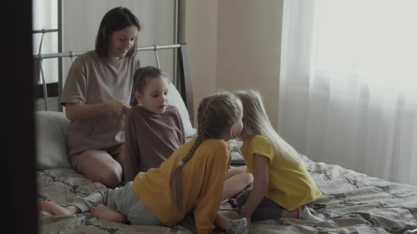 Mom and Three Daughters at Home