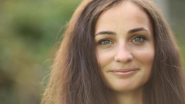 Portrait of Cheerful Woman Smiles and Enjoys of the Moment Isolated on Blur Background