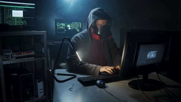 Bio-Terrorist types in computer code wearing a gas mask. alt