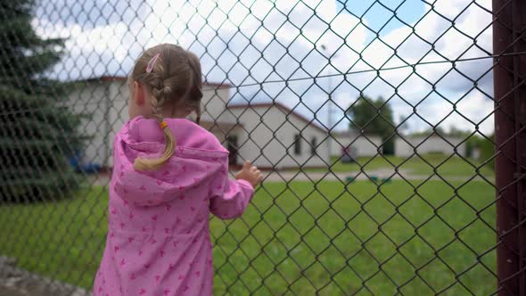 Closeup Child Boy Hand Holding Steel Fence