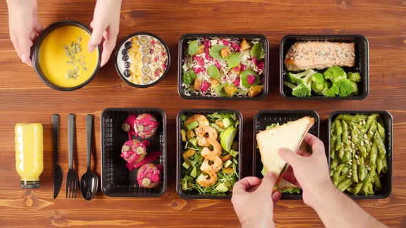 Food Delivery Top View Take Away Meals in Disposable Containers on Wooden Table alt