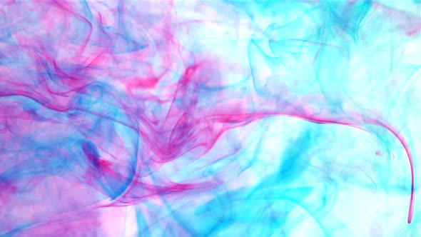 An abstract background of slow moving blue and pink dye ink under the water alt