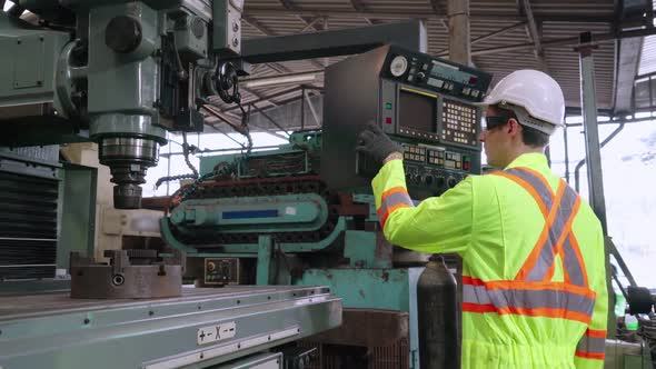 Smart Factory Worker Using Machine in Factory Workshop alt
