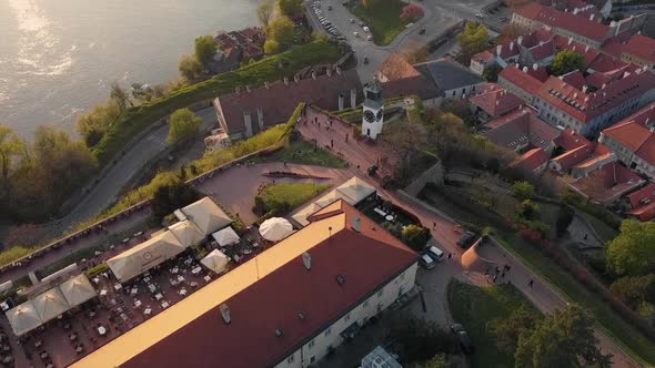 Aerial view of the Petrovaradin fortress in Novi Sad and Danube river, clock tower at sunset
