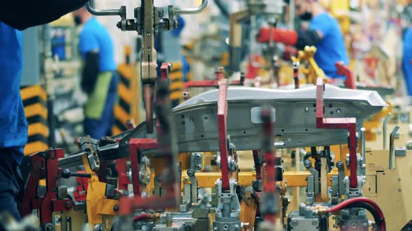 Auto Mechanic, Car Factory Worker Welding a Car Part. Factory Facility Interior, Industrial alt