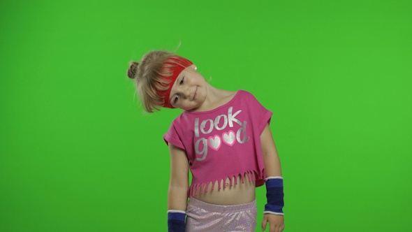 Young Cute Girl in Sportswear Making Fitness Gymnast Home Exercises. Workout for Kids. Sporty Child alt