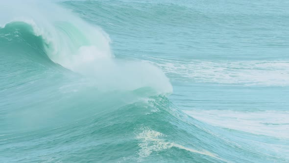 Powerful waves break off coast of Nazare, Portugal, slow motion alt