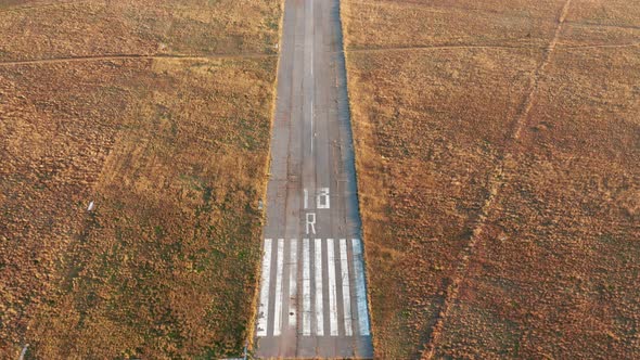 Empty runway of a small airport used for takeoff and landing of light aircraft. Airfield for planes. alt
