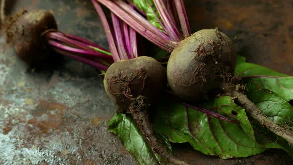 Beetroots with Green Haulm on the Black Rustic Background
