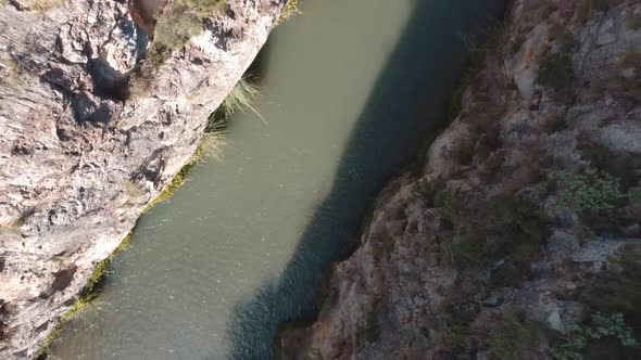 Drone flying up over the river in Valencia, Spain alt