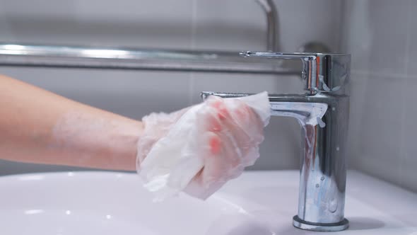 Faucet in the Bathroom Is Equipped with Household Chemicals, Sanitary Treatment and Disinfection of alt