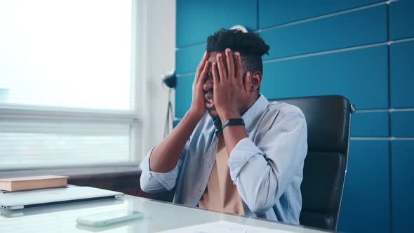 Frustrated African American Man Gets Nervous and Bangs Hands on Office Table alt