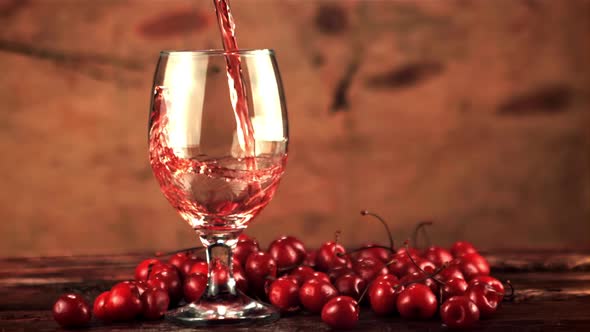 Super Slow Motion in the Glass Pours Cherry Juice Whirlpool alt